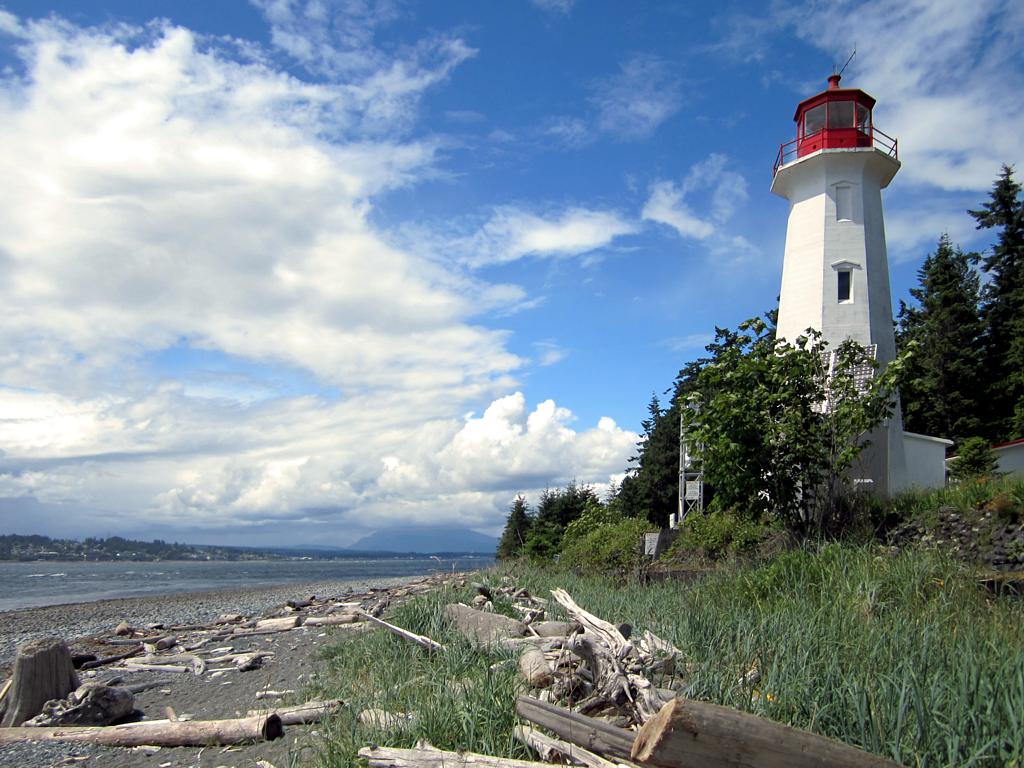 Cape Mudge Lighthouse (1916) on Quadra Island, British Columbia, Canada, overlooks the southern entrance to Discovery Channel.